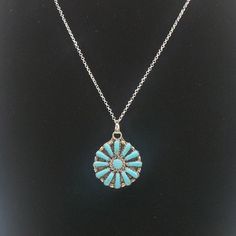 This gorgeous sterling silver cluster flower necklace featuring beautiful turquoise stones. This lovely necklace is truly a statement piece! The stones in this beauty are the perfect color of blue and the craftsmanship is excellent. The size of this piece is similar to a quarter in diameter. And it's unique design, makes it a piece you'll want to wear again and again. This piece is priced well below market price and would make a lovely statement for your favorite outfit or a memorable gift for a Blue Jewelry With Large Flower Pendant, Bohemian Blue Flower Pendant Jewelry, Turquoise Sterling Silver Flower Pendant Necklace, Blue Southwestern Jewelry With Large Pendant, Southwestern Style Blue Jewelry With Large Pendant, Presents For Teenage Girls, Squash Blossom Necklace, Market Price