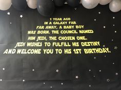 a black and white birthday party backdrop with balloons, stars and the words star wars written on it