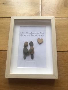 two rocks in a white frame with the words, it takes a place in your heart that you never knew was empty