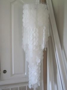 a white curtain hanging from the side of a door