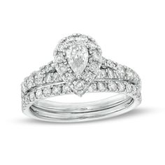 Celebrate your love with this classic diamond bridal set. Crafted in cool 10K white gold, the engagement ring showcases a 1/3 ct. pear-shaped diamond wrapped in a diamond-lined frame. Multi-sized diamonds glisten along the subtly split shank. Completing her look, the contoured wedding band sparkles with a row of diamonds. Captivating with 1-1/2 cts. t.w. of diamonds and a bright polished shine, this bridal set makes every moment sparkle. Contoured Wedding Band, Dream Wedding Ring, Contour Wedding Band, Diamond Frame, Diamond Bridal Sets, Split Shank, Pear Shaped Diamond, Bridal Set, Bridal Sets