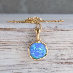 Unique Round Blue Opal Pendant Necklace, Made of 925 Sterling Silver Coated With 14K Yellow Gold Plated Handmade by Aditagold.  This beautiful handmade blue opal gemstone necklace is made of silver, coated with real 14K gold, and is carefully handcrafted at my workshop in Israel. Opal is October's birthstone, and this opal yellow gold plated pendant necklace will be perfect for any occasion. It is classic and elegant and will add a beautiful sparkle to a day or evening look.  Item details   * Ye Blue Opal Necklace, Cheap Necklaces, Opal Pendant Necklace, 14k Gold Necklace, Jewelry Boho, Necklace Blue, Gemstone Necklace Pendant, Necklace Dainty, Opal Pendants