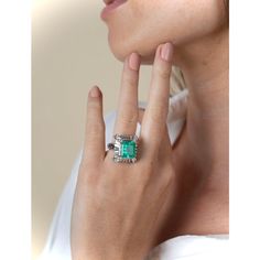 Top-quality vintage natural Emerald ring. This Emerald has Colombian origins, as it was mined over 20 years ago from the famous Muzo mines in the western Boyaca province of the Colombian Andes mountains. Center stone is mounted in an elaborate baguette-cut diamond halo.  A true one-of-a-kind, handmade ring. This ring is for those with a refined and sophisticated taste in fine jewelry. Superbly clean and brilliant VS1 natural diamonds with an acutely textured ring shank. All culminated with an ex Elegant Untreated Emerald Ring For Anniversary, Baguette Diamond Ring, Natural Emerald Rings, Andes Mountains, Baguette Diamond Rings, Ring Shank, Colombian Emeralds, Textured Ring, Baguette Cut Diamond