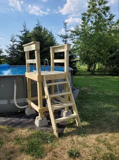 a ladder that is next to a swimming pool with a ladder in the middle of it