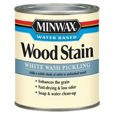 a can of wood stain sitting on top of a white table