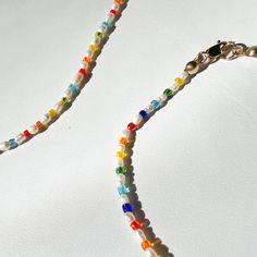 A delicate alternating rainbow glass bead and baby freshwater pearl bracelet. Hand beaded on string and fastened on a 14k gold filled lobster clasp. Nickel and lead free. Measurements & Composition: 7.5" bracelet length 2 mm glass beads 2-3mm freshwater pearl beads 14k gold filled lobster clasp Diy Jewelry Inspiration, Baby Pearls, Rainbow Glass, Freshwater Pearl Bracelet, Rainbow Baby, Hand Beading, Glass Bead, Pearl Bracelet, Pearl Beads