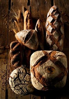 several loaves of bread sitting next to each other