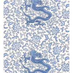 a blue and white dragon pattern on fabric