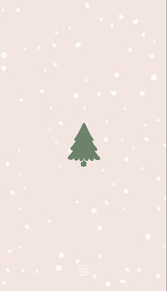 a green christmas tree sitting on top of a snow covered ground