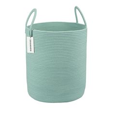 a large round basket with handles in aqua blue color, on a white background for use as a storage container