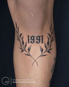 a man with a tattoo on his leg