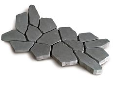 several pieces of gray stone sitting on top of each other