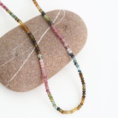 This gorgeous Tourmaline necklace in shimmering translucent multicolor shades of deep pink, steel blue, green, brown and rust is named after Jericho Poppler, who started surfing at age 12. Jericho is an active environmentalist, and she served a five-year term as a board member of the Surfrider Foundation during the 1980s. She created "Jericho's Kids for Clean Waves" in 1993, a surf contest for children under 16, that features environmental outreach and educational programs. Details: AAA 3mm faceted round watermelon tourmaline stones Length is 16", with 2" extension Clasp, closure and extension chain in your choice, Sterling Silver of 14kt Gold Fill Each stone has natural variations; colors may vary slightly Handcrafted in Los Angeles, California, USA Multicolor Faceted Tourmaline Necklaces, Bohemian Multicolor Tourmaline Necklaces, Handmade Multicolor Tourmaline Necklaces, Earrings Quotes, Surfrider Foundation, Watermelon Tourmaline Necklace, Bracelet Quotes, Necklace Quotes, Board Member