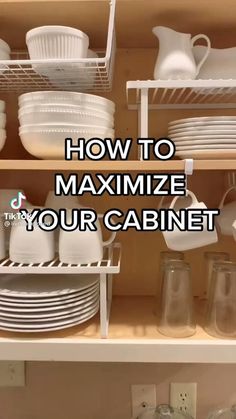 the bottom shelf of a cabinet filled with white dishes and cups, which is labeled how to minimize your cabinet space