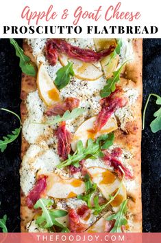 an apple and goat cheese flatbread on a black surface with text overlay that reads the food joy