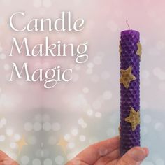 a hand holding a purple candle with gold stars on it and the words candle making magic