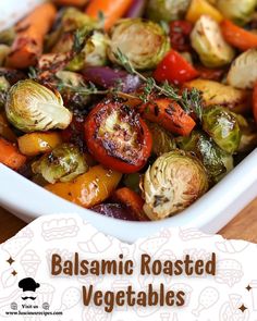 roasted vegetables in a white dish on a wooden table