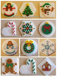 cross stitch christmas ornaments are displayed on the table