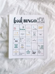 the book bingo is sitting on top of a white sheet