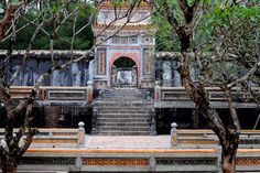 an outdoor area with steps and trees in the foreground