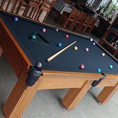 a pool table with several balls on it