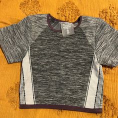 Convinced Myself That I’d Have The Abs To Wear This One Day Lol- It’s A Great Stretchy Material! Never Worn- Just Tried On! Sporty Gray Tops For Light Exercise, Purple Go-dry Athleisure Top, Purple Stretch Crop Top With Short Sleeves, Purple Short Sleeve Activewear For Workout, Casual Gray Crop Top For Sports, Gray Casual Top For Light Exercise, Casual Gray Top For Light Exercise, Casual Heather Sports Tops, Purple Short Sleeve Activewear For Sports