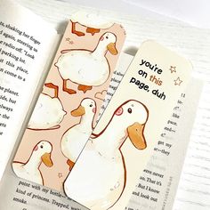 two bookmarks with ducks on them and the words you're on this page