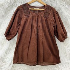 Custom Designed In Mexico, With Natural Dyes On 100% Linen Fabric. Hand Embroidered Designs. Dry Clean Or Hand Wash On Gentle Cycle With Like Colors. Pit To Pit: 19 Inches Length: 25 Inches Width At Bottom: 22.5 Inches Brown Cotton Top With Floral Embroidery, Bohemian Half-sleeve Blouse With Floral Embroidery, Cotton Peasant Top With 3/4 Sleeves For Fall, Summer Brown Blouse With Floral Embroidery, Bohemian Blouse With Floral Embroidery And Half Sleeves, Fall Cotton Peasant Top With 3/4 Sleeves, Bohemian Half Sleeve Blouse With Floral Embroidery, Bohemian Half Sleeve Tops For Fall, Spring Embroidered Cotton Top With 3/4 Sleeves