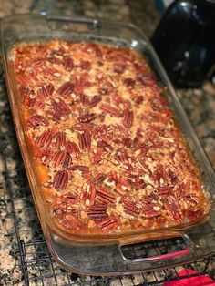 a casserole dish with pecans in it