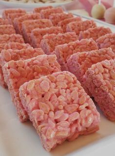 several squares of food sitting on top of a white plate