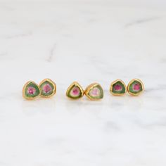 A bar earring set made with a rare green watermelon tourmaline crystal. This green watermelon colored tourmaline features green hues and goes well with our watermelon tourmaline stacking ring :). Consider pairing it with our scalpolite purple bar ring or our aquamarine bar ring! ✨ 14k Gold Filled Earring Post and Back 24k Gold Dipped for deeper color. Genuine Green Watermelon Tourmaline 6-10mm long. ✨ Handmade Tourmaline Green Earrings, Handmade Green Tourmaline Earrings, Green Tourmaline Earrings For Gift, Purple Bar, Bar Earring, Green Watermelon, Tourmaline Earrings, Bar Ring, Green Hues