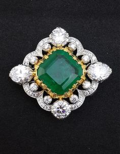 Gorgeous Victorian-style brooch pin set with a square-cut emerald center stone surrounded with white CZ. The center Asscher is plated with 14k gold which gives it an elegant look. The total carat weight of the brooch is approx 40 carats. About the Product: Metal: Solid 925 Sterling Silver Stones: Cubic Zirconia Grade: AAAAA Cut: Excellent Clarity: Excellent Why Buy from Adastra? 1. The USA patented 925 Sterling Silver, making each creation last for decades. 2. Each of our products is skin-friend Heritage Jewellery, Historical Jewellery, Green Square, Diamond Brooch, Cz Jewelry, Royal Jewelry, Crown Jewels, Square Cut, Dream Jewelry