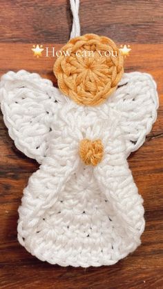 crocheted angel ornament on wooden table