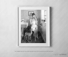 an old photo of a woman brushing her teeth with a dog in front of the sink