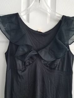 This is a vintage, Gilead night gown. It is sleeveless and has a ruffled portion. It is nylon, made in the usa and floor length. There are some flaws in the material as you can see in the images. The price reflects this. All sales are final. The measurements are as follows: (measurements taken flat and unstretched) Nightgown: Armpit to Armpit: 18 inches Waist: 17.5 inches Hips: 26 inches Length from top of shoulder to middle of hem: 52.5 inches This is a very elegant piece. It is timeless and cl Fitted Ruffle Camisole Dress, Fitted Camisole Dress With Ruffles, Sleeveless Dress For Night Occasion, Fitted Satin Nightgown For Summer, Solid Sleeveless Party Nightgown, Sleeveless Solid Color Party Nightgown, Fitted Summer Nightgown, Fitted Nightgown For Summer Parties, Sleeveless Satin Nightgown