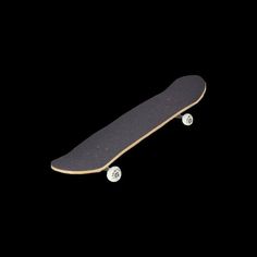 a skateboard is shown in the dark with no wheels or rims on it