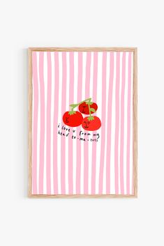 two tomatoes on pink and white striped paper with the words love is in the air