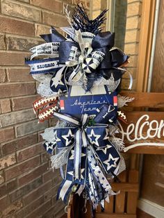 an american flag wreath with footballs and stars on it