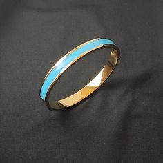 "Discover the exquisite elegance that our 18K Enamel Bangle Blue can bring to your wardrobe. Every piece of this unique Blue Gold Bangle - crafted for the modern woman and designed with a sophisticated blend of classic and contemporary aesthetics. 💍  This stunning accessory is more than just a Colorful Bangle; it is a testament to timeless style and luxurious simplicity. It perfectly complements any outfit, making for a beautiful Wedding Bangle or as a stylish addition to your everyday attire. Italian Gold Jewelry, Colorful Bangles, 18k Gold Bracelet, Enamel Bangle, Snake Jewelry, Outfit Making, Gold Bangle, Dainty Bracelets, Love Bracelets