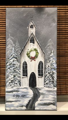 a painting of a white church in the snow with wreaths on it's door