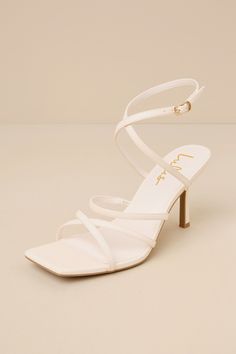 Making any look more glamorous is easy when you have the Lulus Skyy Beige Strappy High Heel Sandals! Smooth faux leather shapes these stunning heels that feature a trendy square footbed, crisscrossing toe straps, and a slender vamp strap (with elastic at the side for fit). Matching straps cross at the front and secure around the ankle with a gold buckle, all atop a stiletto heel. 3. 25" wrapped stiletto heel. Cushioned insole. Rubber sole has nonskid markings. Man made materials. Imported. Lulus Summer Evening Heels With Crisscross Straps, Elegant Summer Heels With Crisscross Straps, Chic Sandals With Crisscross Ankle Straps, Open Toe Heels With Crisscross Straps For Evening, Evening Open Toe Heels With Crisscross Straps, Evening Heels With Crisscross Straps And Open Toe, Elegant High Heels With Crisscross Straps, Evening Open Toe Sandals With Crisscross Straps, Evening Sandals With Crisscross Straps And Open Toe