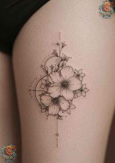 a woman's thigh with flowers on it and an arrow in the middle of the thigh