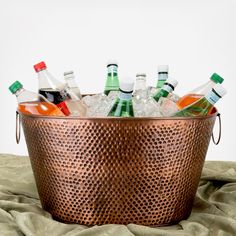 a metal bucket filled with lots of bottles