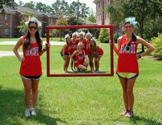 two girls are standing in front of a mirror with the word aoa on it