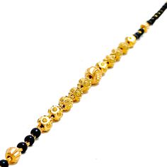 Weighing 4.3 grams, this 22k gold bracelet showcases a graceful yet jazzy design with black bead accents set against a radiant yellow gold finish. The 7.2-inch length, coupled with adjustable 0.6-inch links, ensures a perfect fit for any wrist. Secured by a hook lock, this bracelet offers a beautiful blend of traditional charm and modern flair, making it a versatile piece for both everyday wear and special occasions. PRODUCT DETAILS Gold Purity(karat): 22k Item Weight(grams): 4.3 Item Finish: Ye Traditional Gold Bracelets With Black Beads, Traditional Gold Bracelet With Black Beads, Traditional Gold Beaded Bracelet With Black Beads, Black Bracelets For Festivals, Black Festive Bracelets For Festivals, Gold Bracelets With Round Beads In 22k Gold, Black 22k Gold Jewelry With Round Beads, Adjustable Yellow Gold Bracelet For Festive Occasions, Traditional Yellow Gold Bracelets With Gold Beads