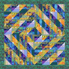 a colorful quilt with many different patterns on it