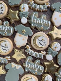 baby shower cookies are arranged on a table