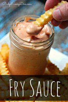 a person dipping some food into a jar with the words fry sauce on it and an image of french fries