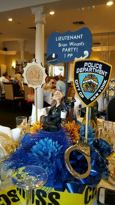 a police cake with decorations on it at a party