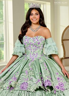 Make a grand entrance in this multicolored floral embroidered long strapless dress with A-line tiered lace skirt by Rachel Allan RQ5002. Introducing the ultimate dress of grace, elegance, and tradition! This enchanting taffeta ballgown has been meticulously crafted to make every quinceanera girl's dreams come true. With its captivating lace detail, dazzling applique and beading, and the added touch of detachable tulle sleeves, this dress is truly a masterpiece. Floral Tiered Lace Quinceanera Dre Detachable Tulle Sleeves, Floral Ballgown, Red Quinceanera Dresses, Black Ball Gown, Tulle Sleeves, Rachel Allan, Dress Guide, Sweet 16 Dresses, Quince Dresses